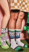 Two pairs of legs wearing colorful socks with a checkered skirt and green shoes.
Sælar - sokkar Xpooos - bestu sokkarnir - sætir sokkar