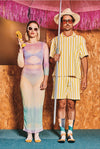Two people in colorful outfits standing against a wooden wall with pink tinsel.
Sælar sokkar Xpooos - bestu sokkarnir - sætir sokkar